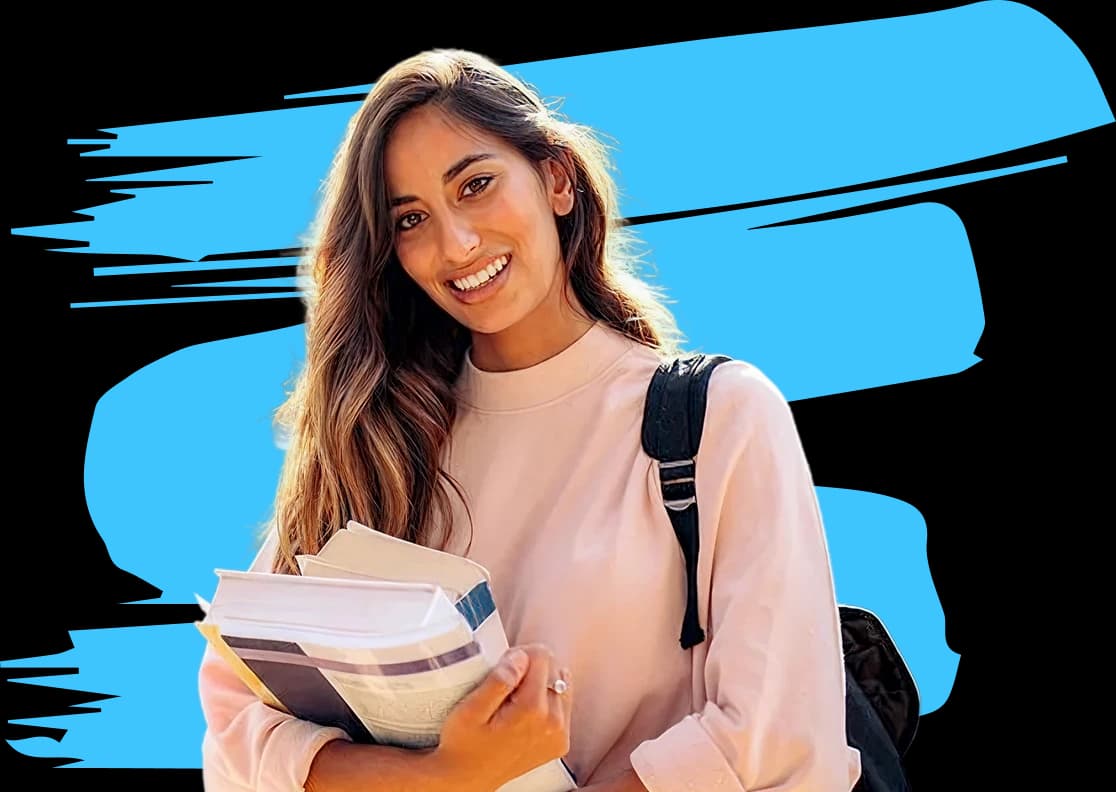 Student smiling by hoding the books