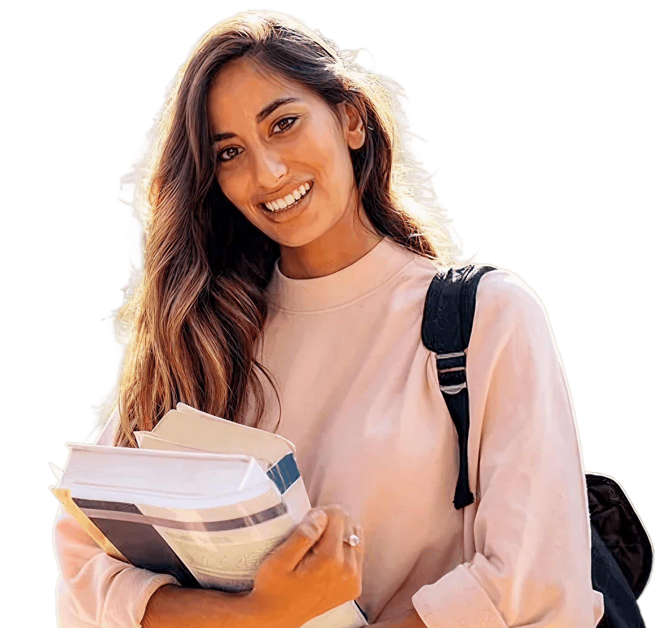A student smiling while holding a stack of books, ready to find her future-ready degree.